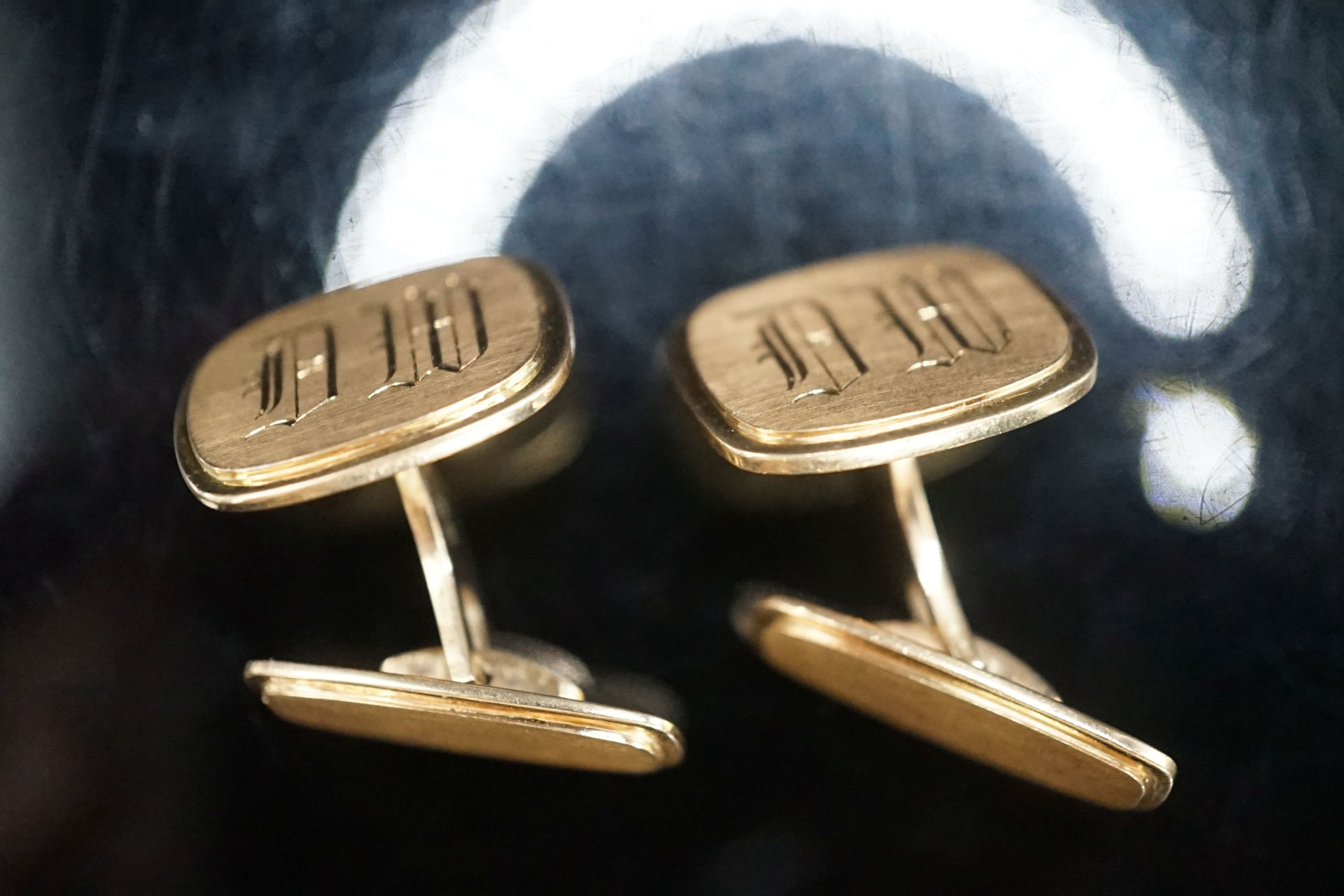 A pair of 585 yellow metal cufflinks, with engraved initials, 18.2 grams.